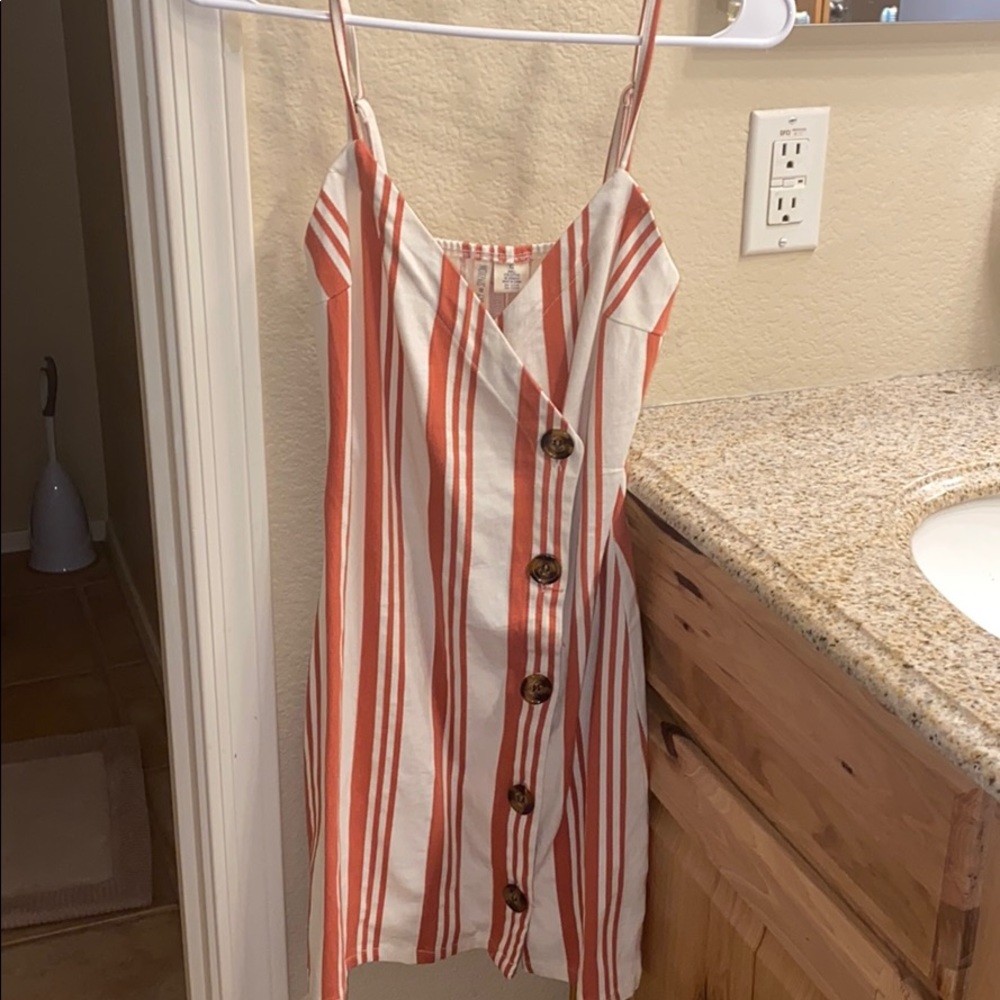Tilly’s cute button wrap dress. Never worn
